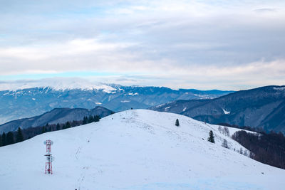 Sun over the winter mountains with snow, cindrel mountains, paltinis, romania