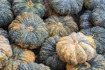 Full frame shot of pumpkins in market