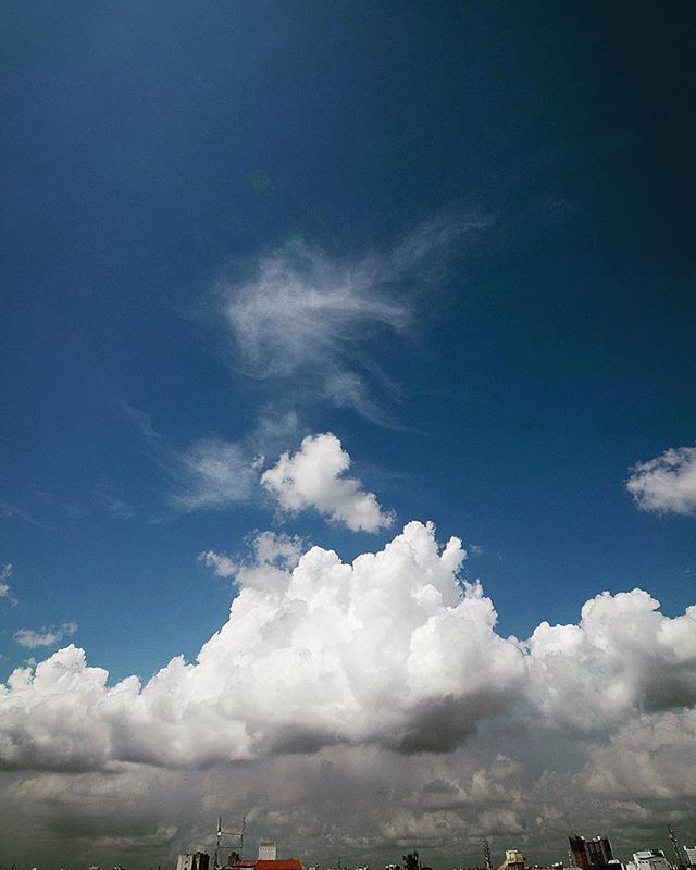 sky, cloud - sky, blue, low angle view, cloudy, beauty in nature, scenics, cloud, tranquility, nature, tranquil scene, cloudscape, weather, outdoors, day, no people, idyllic, landscape, tree, white color