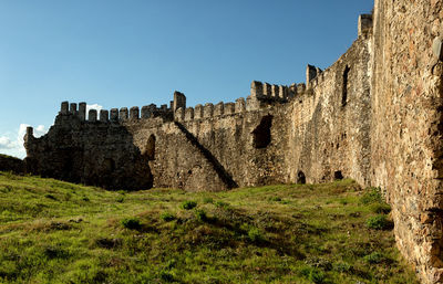 Low angle view of fort against clear sky