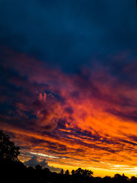 Low angle view of dramatic sky during sunset