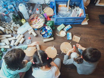 High angle view of girls making art indoors