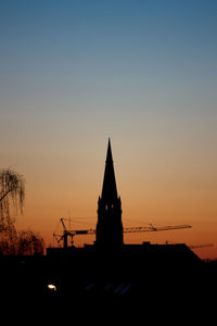 Silhouette temple against sky during sunset