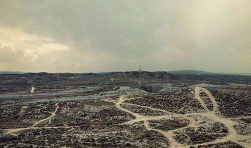 Aerial view of arid landscape against sky