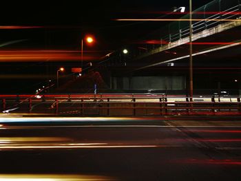 Light trails on road in city at night