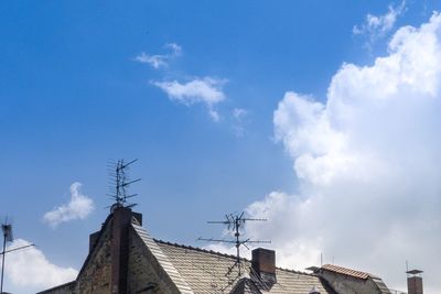 Low angle view of building against cloudy sky