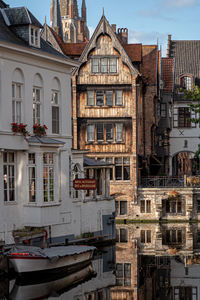 Buildings in town against sky