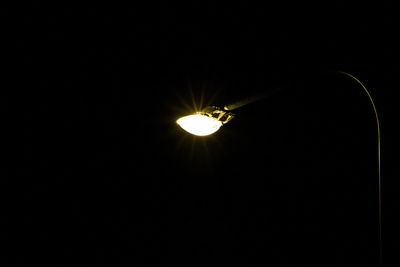 Low angle view of illuminated light bulb