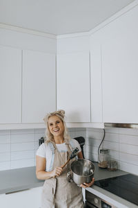 Smiling woman in kitchen