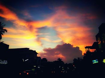 Dramatic sky over city at sunset