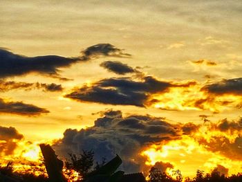 Low angle view of dramatic sky during sunset