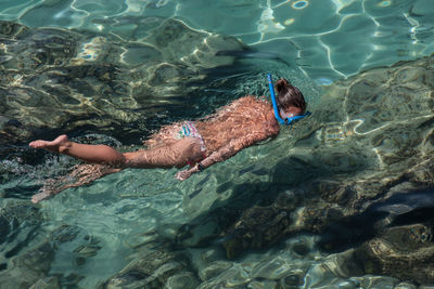 High angle view a snorkeling woman