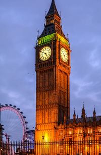 Clock tower against sky in city