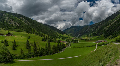 Scenic view of landscape and mountains against sky