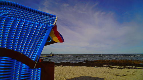 Scenic view of beach against blue sky