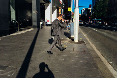 Woman walking on city street