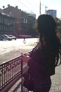 Woman standing in city