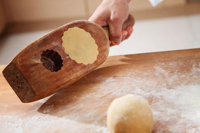 Cropped hands of chef preparing food at kitchen