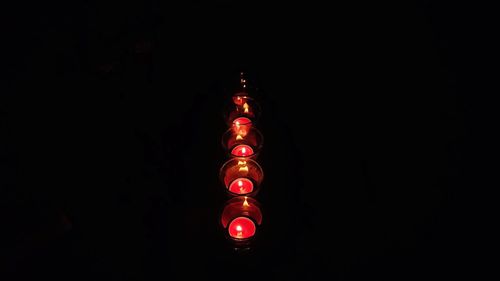 Illuminated christmas lights against black background