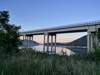 Bridge over river against clear sky