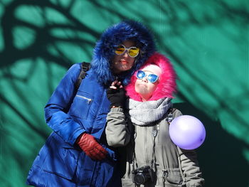 Portrait of woman wearing sunglasses standing outdoors