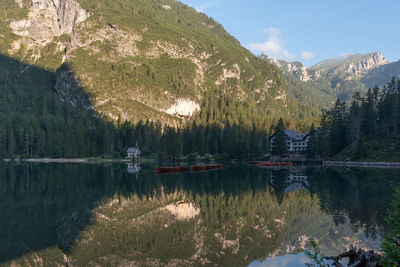 Scenic view of lake and mountains against sky