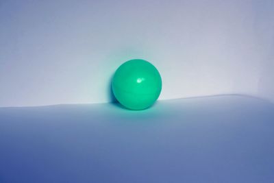 Close-up of blue ball on table