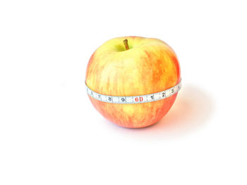 High angle view of apple against white background