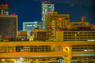 Illuminated buildings in city at night