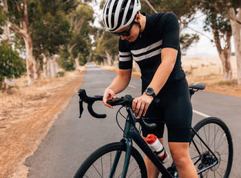 Man riding bicycle on road