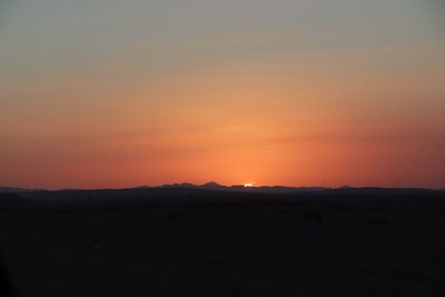Scenic view of silhouette landscape against sky during sunset