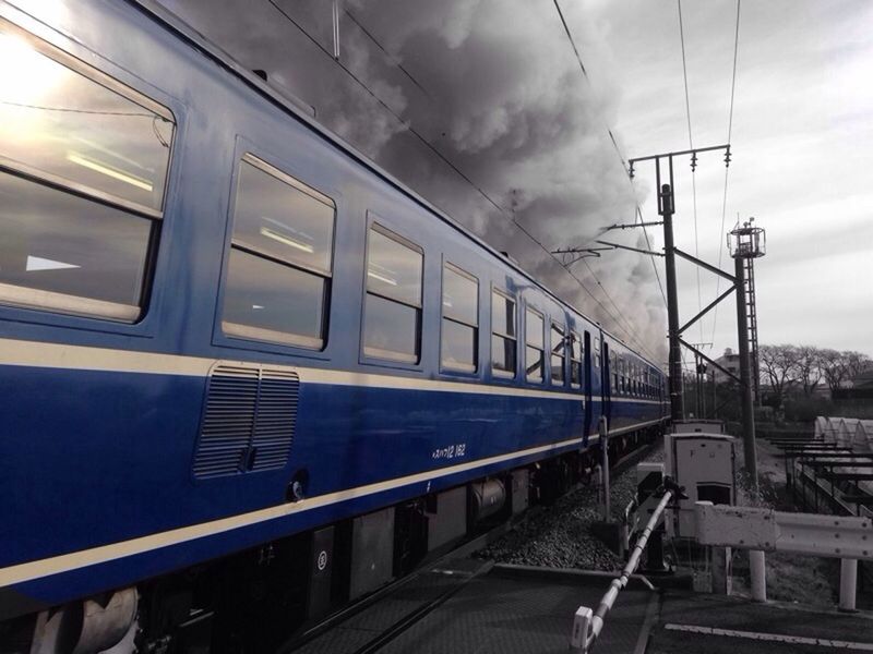 built structure, architecture, transportation, sky, rail transportation, railroad track, indoors, public transportation, railroad station, building exterior, sunlight, train - vehicle, low angle view, cloud - sky, railing, railroad station platform, window, no people, connection, day