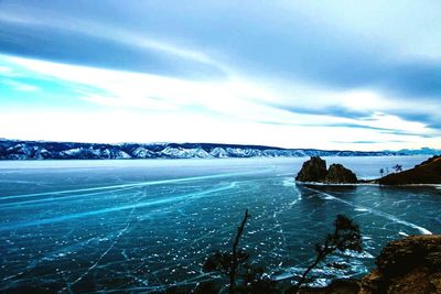 Scenic view of sea against cloudy sky