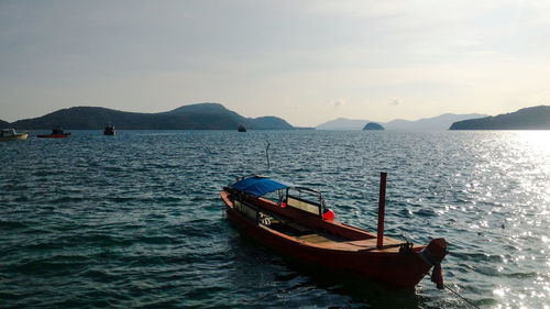 Boat on sea against sky