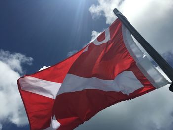 Low angle view of flag against sky