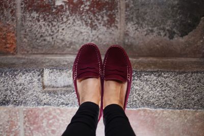 Low section of man standing on floor