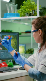 Scientist examining strawberry