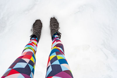 Low section of person skiing on snow