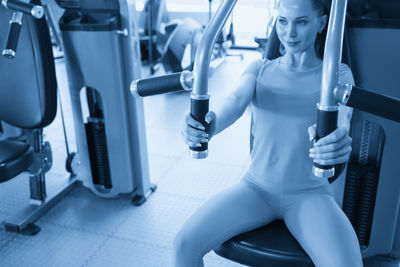 Low section of woman standing in gym