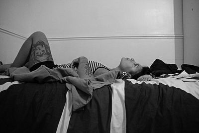 People sleeping on bed at home