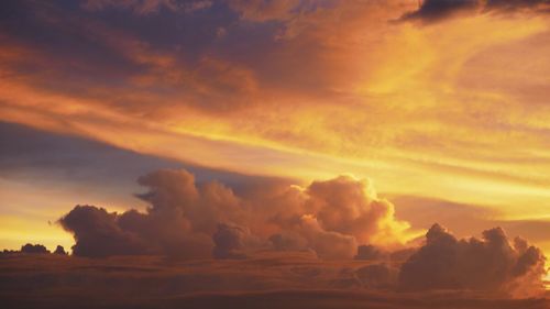 Low angle view of dramatic sky during sunset