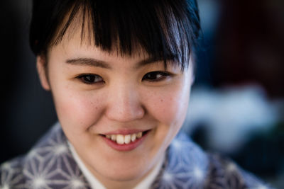 Close-up of smiling young woman