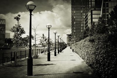 View of empty footpath in city