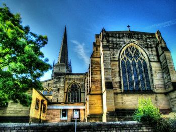 Low angle view of church against blue sky