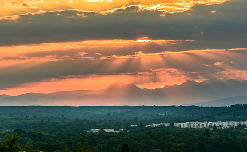 Scenic view of landscape against sky during sunset