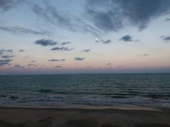 Scenic view of sea against sky at sunset