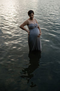 Woman standing in lake