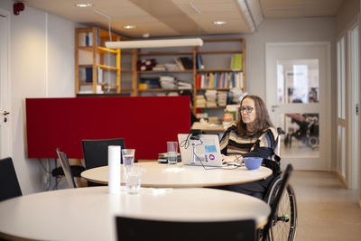 Disabled woman working in office