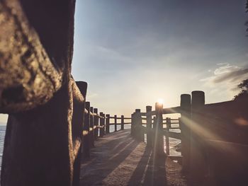 Panoramic view of wooden post against sky during sunset