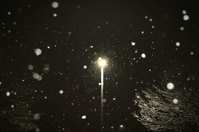 Illuminated street light at night